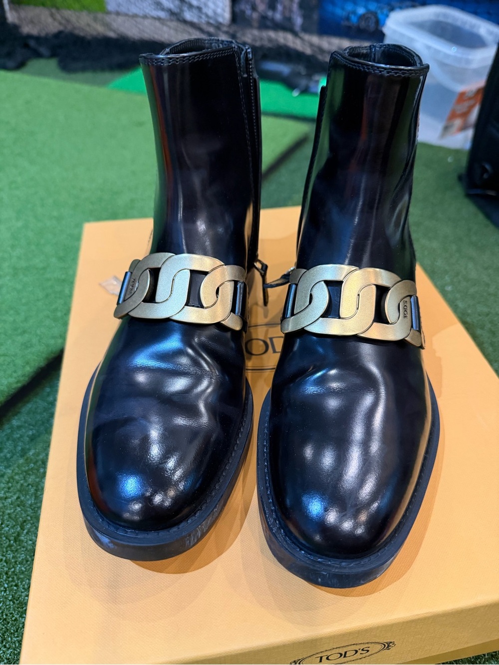 TOD'S Black Leather Ankle Booties with Gold Chain Detail